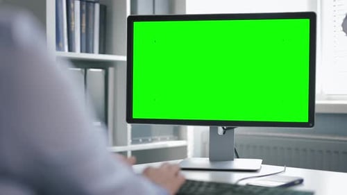 Office Computer with Green Monitor