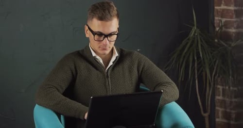 Busy Man Uses Laptop