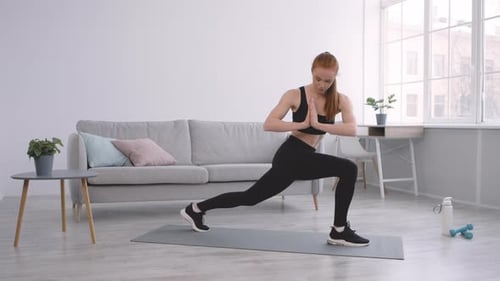 Woman Doing Yoga at Home for Fitness