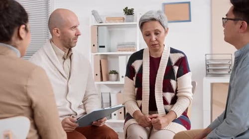 People Support Woman in Group Therapy Session