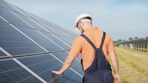 Sustainable Green Energy Jobs Solar Panel Technician Working with Solar Panels