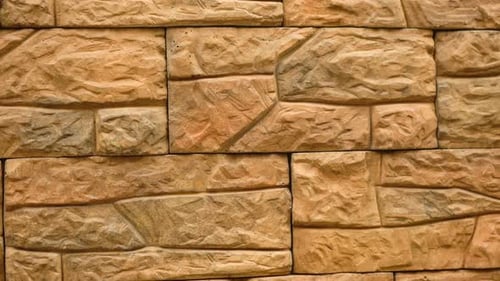 Textured Brown Stone Block Wall, Close Up Panning Shot
