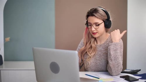 Woman working at computer at home