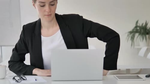 Young Businesswoman Leaving Office