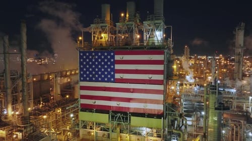 Night Panorama of the Large Factory with American National Symbol on the Tower