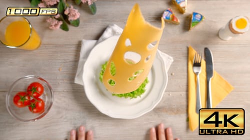 Delicious cheese, lettuce, and tomato sandwich preparation