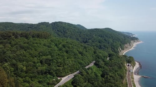 Aerial View From Drone of Curve Road with a Car on the Mountain with Green Forest in Russia