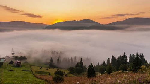 Foggy Valley at Sunrise with Mountain Views