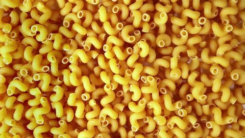 Top View of Uncooked Yellow Pasta. Rotation 360 Degree