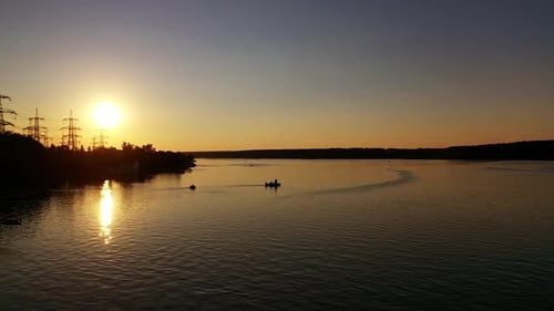 Amazing sunset on river. Aerial view of river with the background of sunset