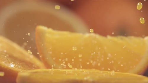 Juicy Orange Slices with Splashing Water Droplets