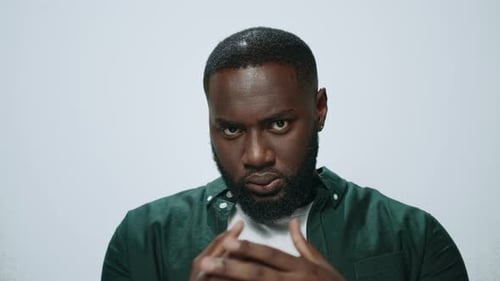 Closeup Indignant African American Man Threatening on Light Background
