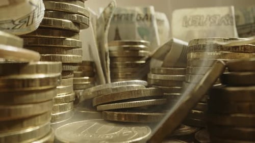 Stacks of Coins and Paper Money Close Up