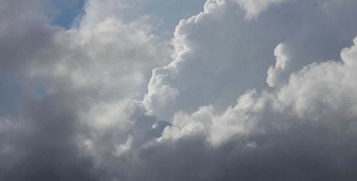 Clouds Moving Across a Summer Blue Sky