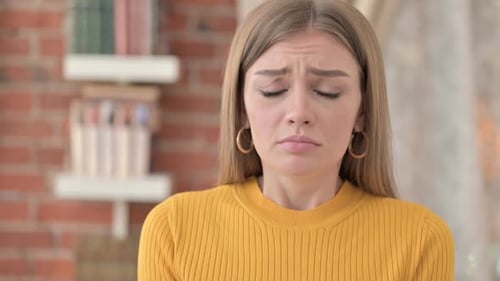 Sad Young Woman with an Upset Facial Expression