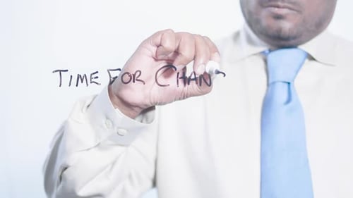 Asian Businessman Writes Time For Change