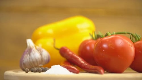 Fresh Vegetables and Herbs on Wooden Board