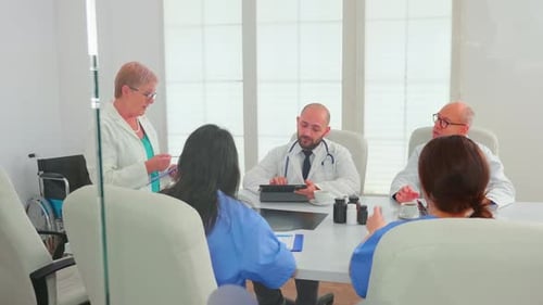 Medical Team Meeting in Bright Conference Room