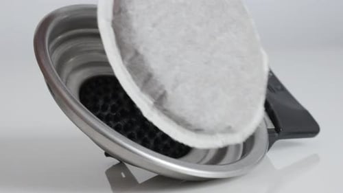 Coffee Pod Placed in Metal Filter, Close Up
