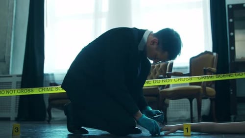 Investigator Examining Crime Scene Evidence Closely