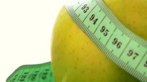 Green, Fresh Apple with Measuring Tape on Black, Rotation, Reflection