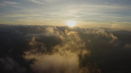 Cinematic View Above the Clouds at Sunset