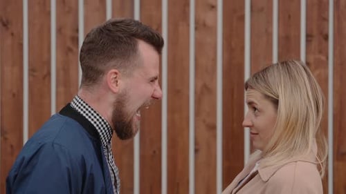 Arguing Couple in Front of Wall