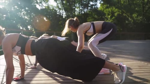 Group Fitness Workout in Sunny Park Setting