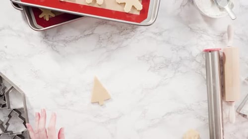 Flat lay. Step by step. Rolling out sugar cookie dough to bake Christmas cookies.