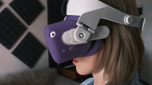 Woman Using Virtual Reality Headset Indoors