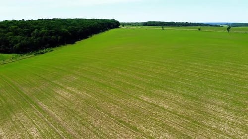 Aerial drone view of a flying over the rural agricultural landscape.