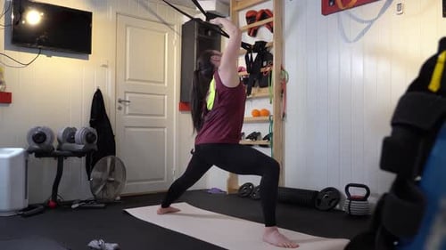 Different yoga poses performed in home gym with various gym equipment in background