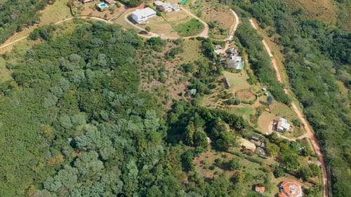 Aerial View of Valley with Farm Field, Forest and Villa in Tropical Country