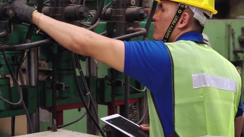 Smart Factory Worker Using Machine in Factory Workshop
