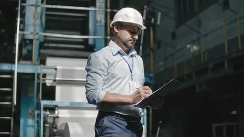 Executive Engineer Inspecting Workshop