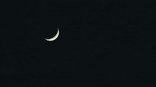 Slender Crescent Moon in Dark Night Sky