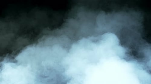 Abstract Light Blue Smoke Puffs on Black Background