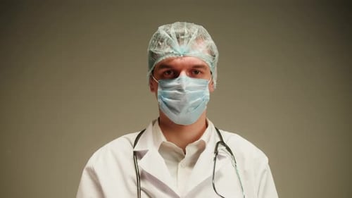 Doctor Wearing Mask, Cap, and Stethoscope