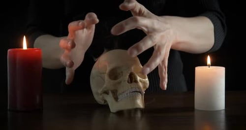 Person Performing Spell with Skull and Candles
