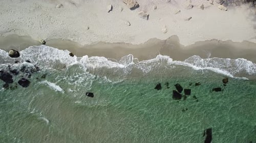 Aerial View of Sandy Beach and Sea Waves