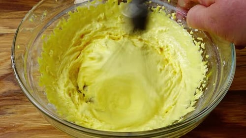 Mixing Yellow Batter in Glass Bowl with Mixer