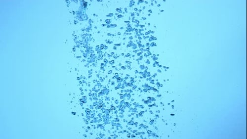 Bubbles Rising in Light Blue Underwater Environment