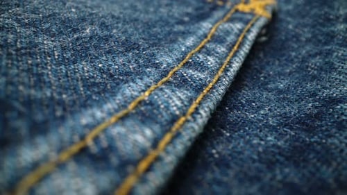 Macro View of Denim Fabric and Stitching