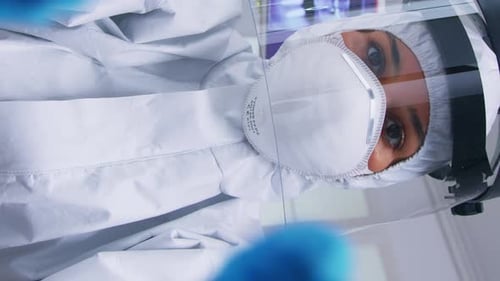Researcher Wearing Full Protective Gear in Lab