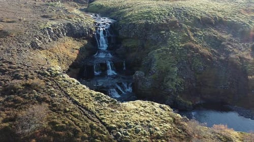 Drone Over Waterfall Into Canyon In Iceland