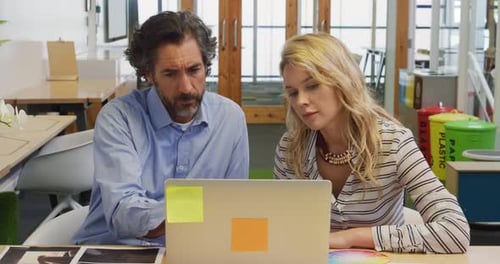 Creative professionals working in a modern office