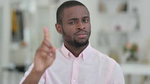 Man Holding Up Finger To Refuse