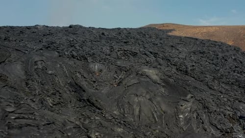 Pull Back Shot of Rugged Surface of Result of Previous Eruption