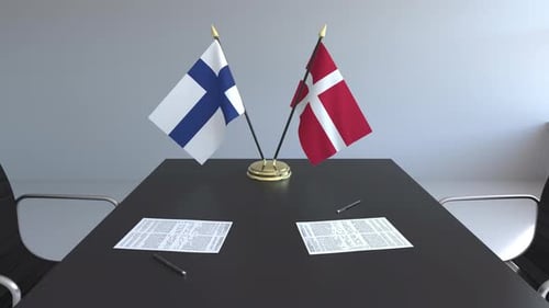 Finland And Denmark Flags On Corporate Meeting Table