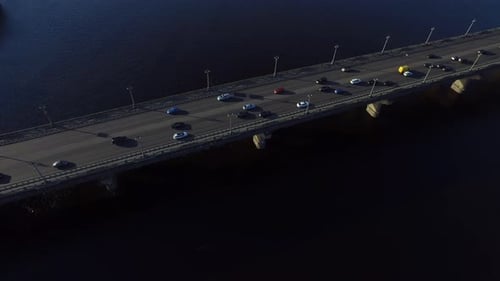 Car Motion on Highway Bridge Over River. Drone View Car Driving on River Bridge